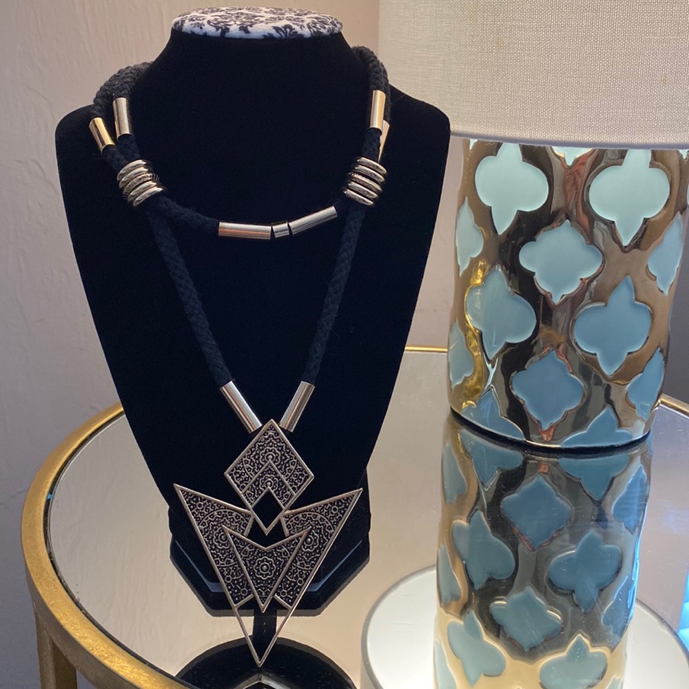 Bohemian/Tribal Necklace. Gold tone metal on black soft cord.